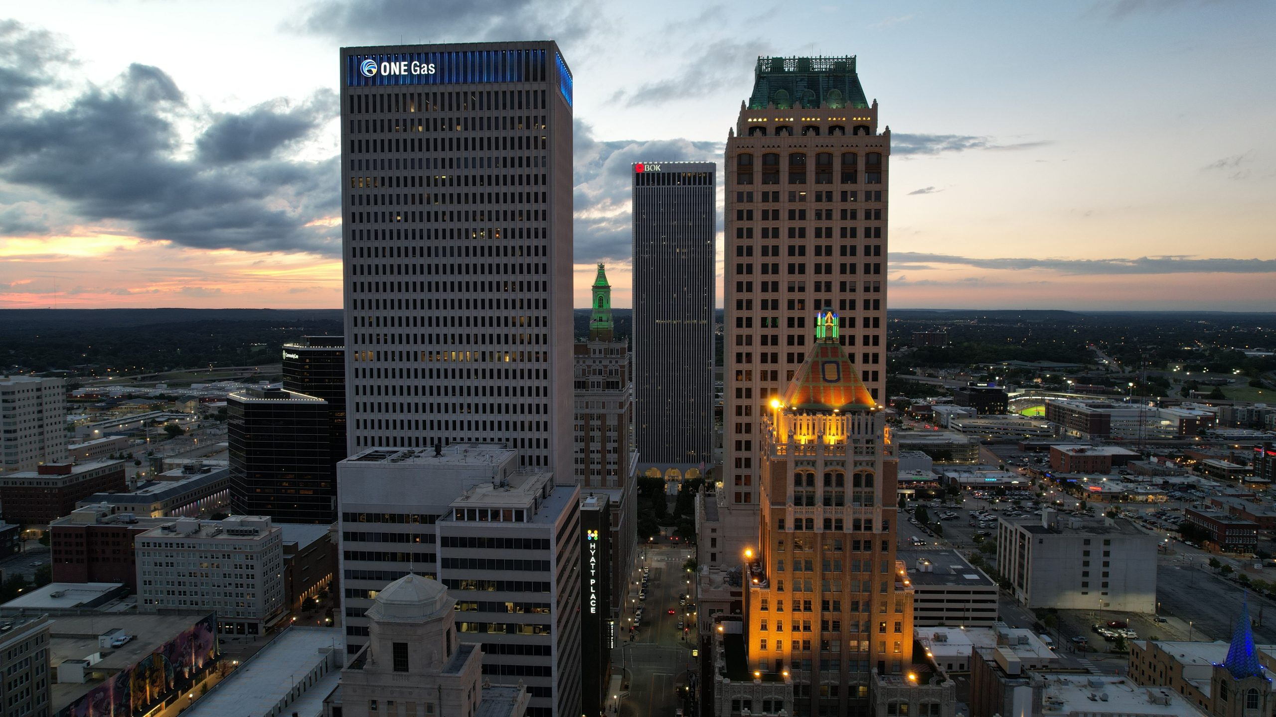 Tulsa, Oklahoma downtown skyline at twilight with illuminated buildings and city lights
